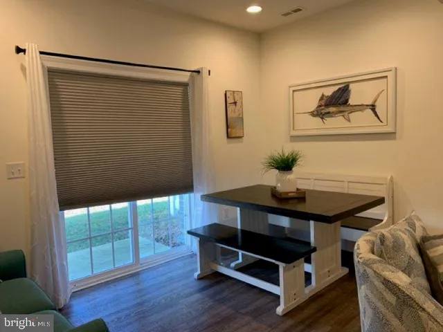 a room with furniture and wooden floor