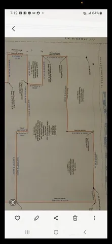 an aerial view of a house with a lake view