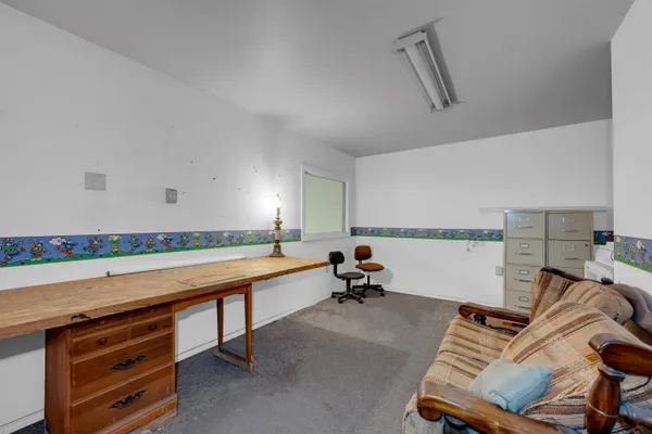 a room with furniture and air hockey table