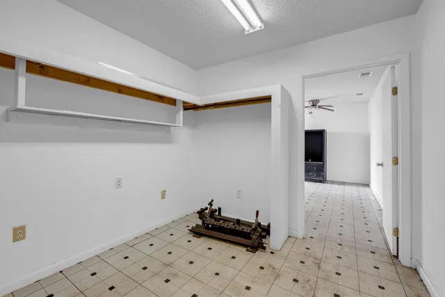 a kitchen with a sink and a stove top oven