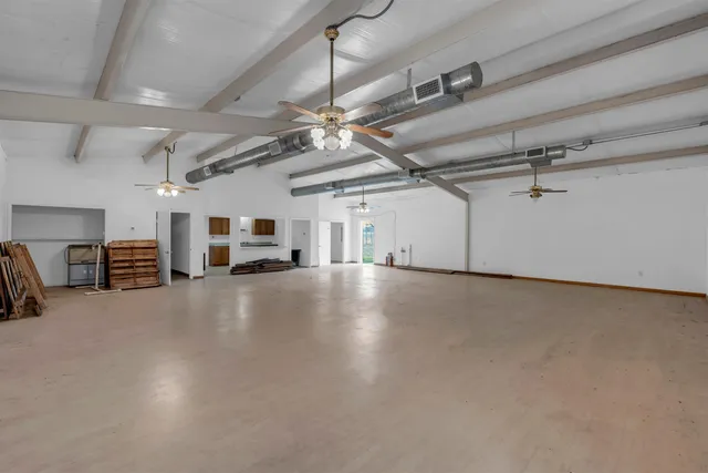 an aerial view of a house with a ocean view
