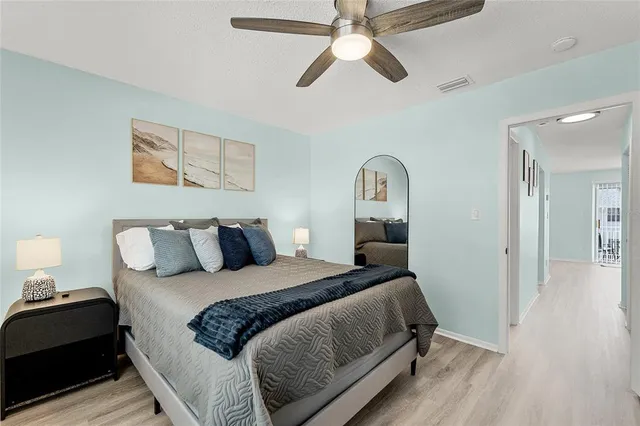 a bedroom with a bed and a television