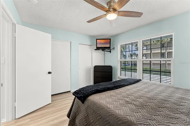 a bedroom with a bed and window