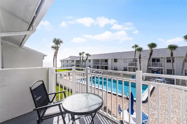 a view of a fountain in front of a house