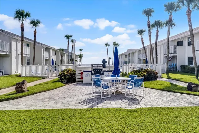 a swimming pool with outdoor seating and yard