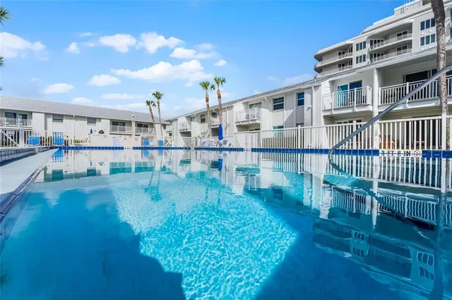 a view of swimming pool with seating space