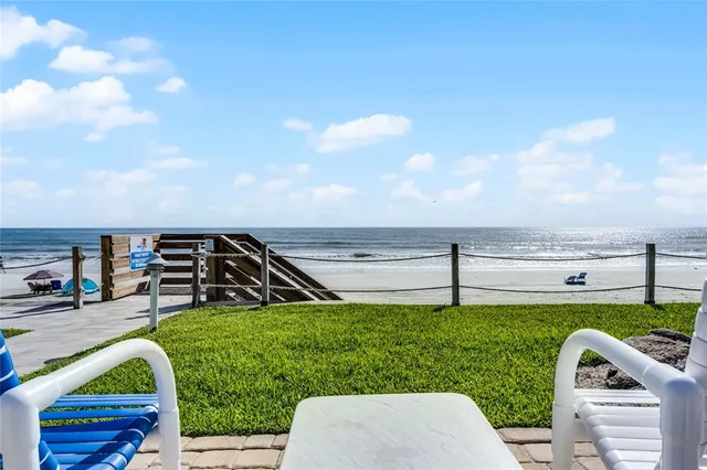 a view of a swimming pool with a yard