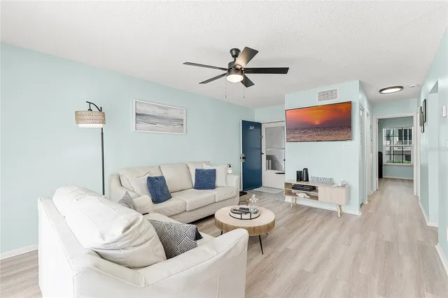 a living room with furniture and a window