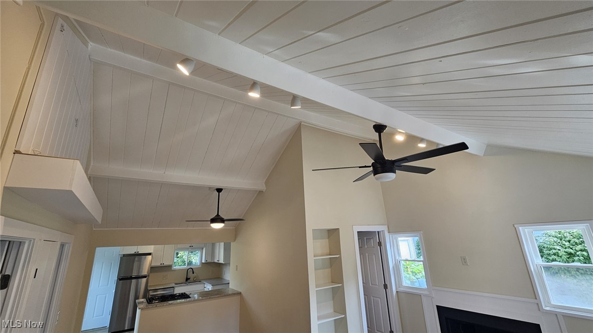 266 Rustic Rook Road Chippewa Lake, OH 44215 - Photo 9 of 31 Details with beam ceiling, ceiling fan, built in shelves, and stainless steel refrigerator