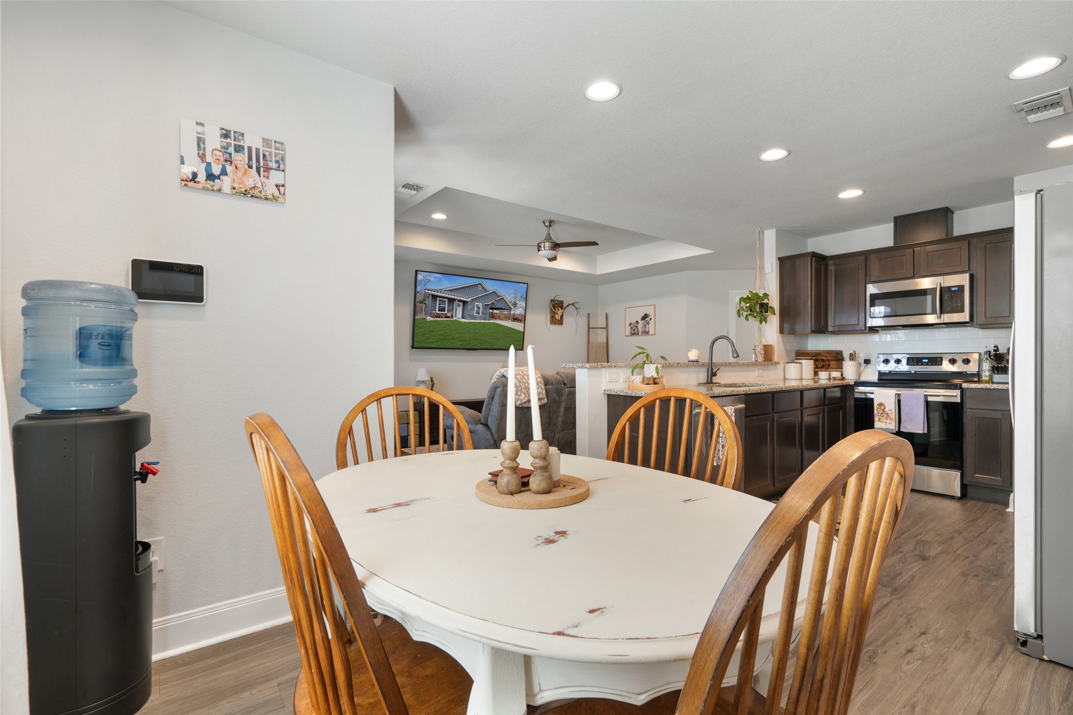 602 South Pierce Street Burnet, TX 78611 - Photo 11 of 29 a kitchen with stainless steel appliances kitchen island granite countertop a dining table and chairs