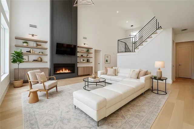 a living room with furniture and a fireplace