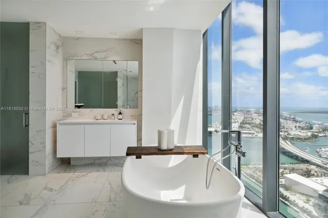 a bathroom with a bathtub and a sink