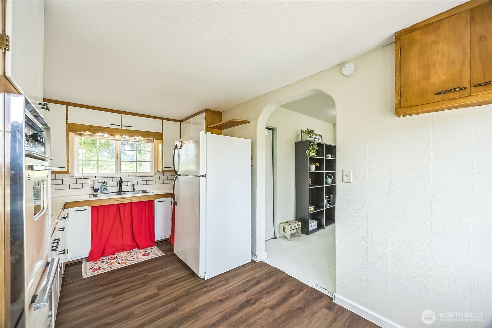 143 Mauerman Road Chehalis, WA 98532 - Photo 20 of 31 a view of a bedroom with wooden floor and door