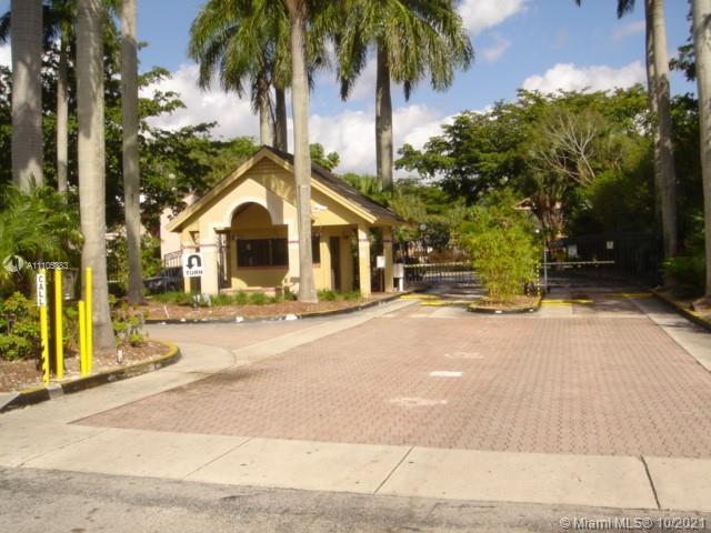 9103 Southwest 138th Place, Unit 9103 Miami, FL 33186 - Photo 2 of 30 a view of a house with a yard and palm trees