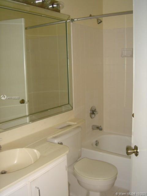 9103 Southwest 138th Place, Unit 9103 Miami, FL 33186 - Photo 15 of 30 a bathroom with a sink and a shower