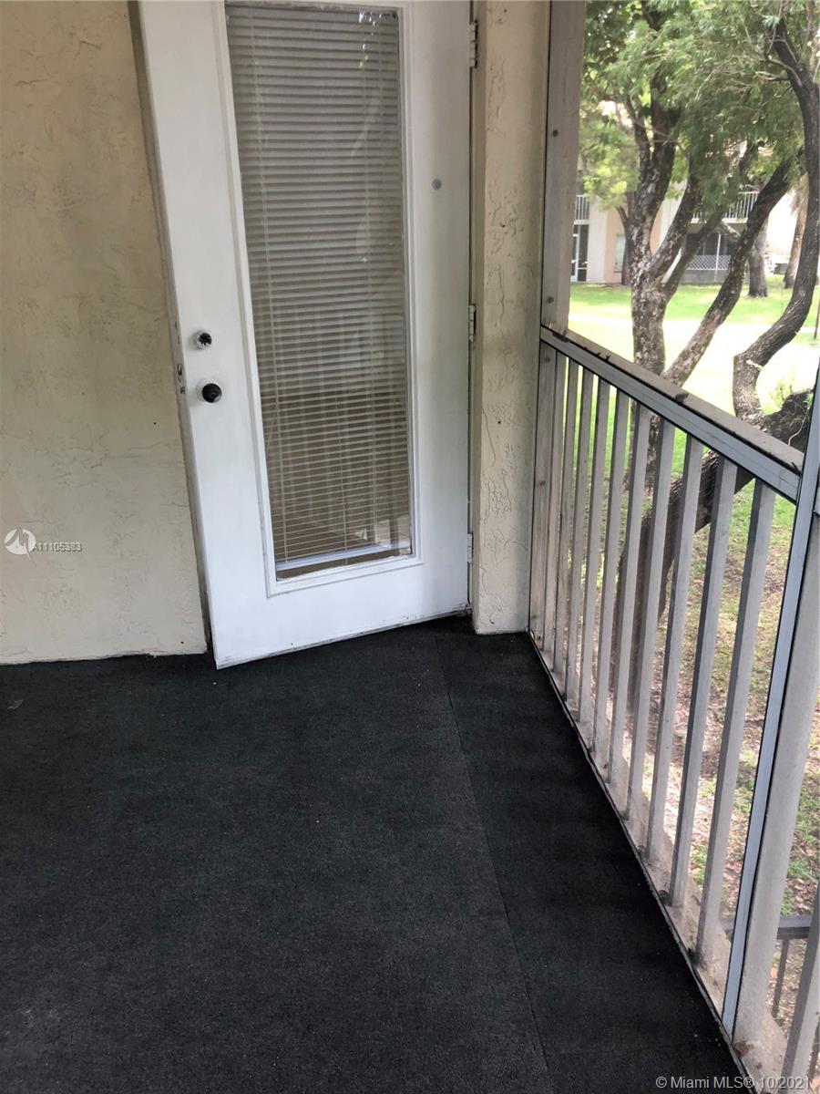 9103 Southwest 138th Place, Unit 9103 Miami, FL 33186 - Photo 16 of 30 a view of a hallway