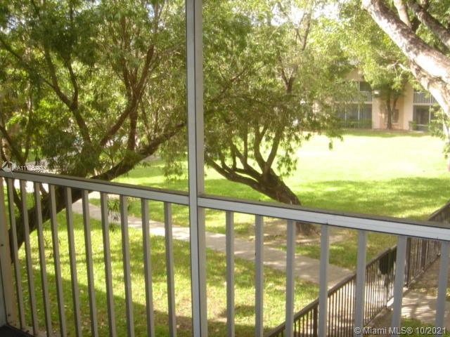 9103 Southwest 138th Place, Unit 9103 Miami, FL 33186 - Photo 17 of 30 a view of outdoor with large trees