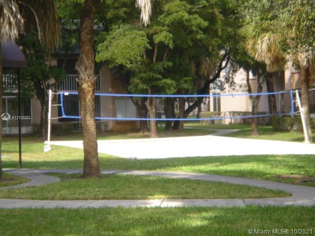 9103 Southwest 138th Place, Unit 9103 Miami, FL 33186 - Photo 22 of 30 a view of a house with a yard