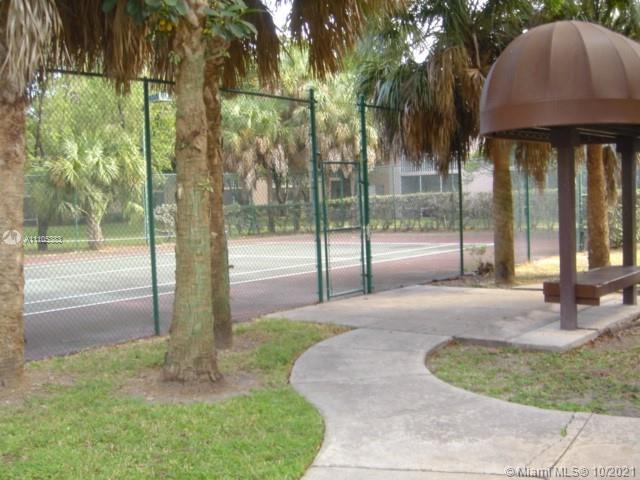 9103 Southwest 138th Place, Unit 9103 Miami, FL 33186 - Photo 27 of 30 a view of a house with backyard and porch