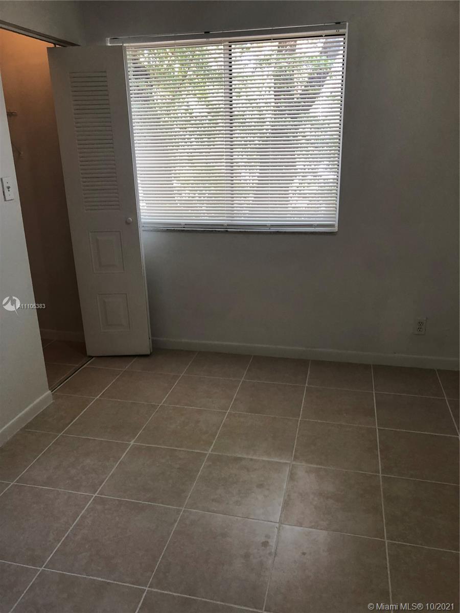 9103 Southwest 138th Place, Unit 9103 Miami, FL 33186 - Photo 10 of 30 a view of a window in a room