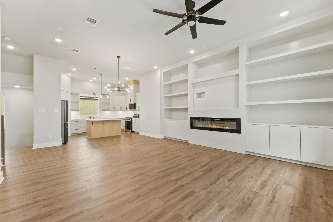 a view of a kitchen with a sink and a living room