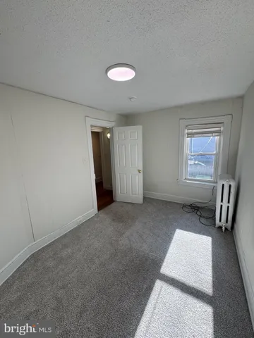 a bathroom with a sink and a window