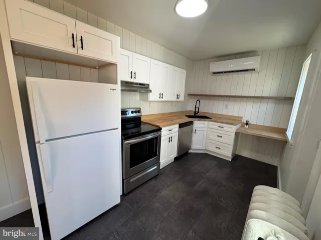 an empty room with staircase