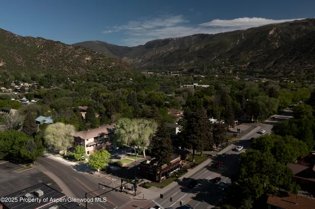 a view of a city with mountains in the background