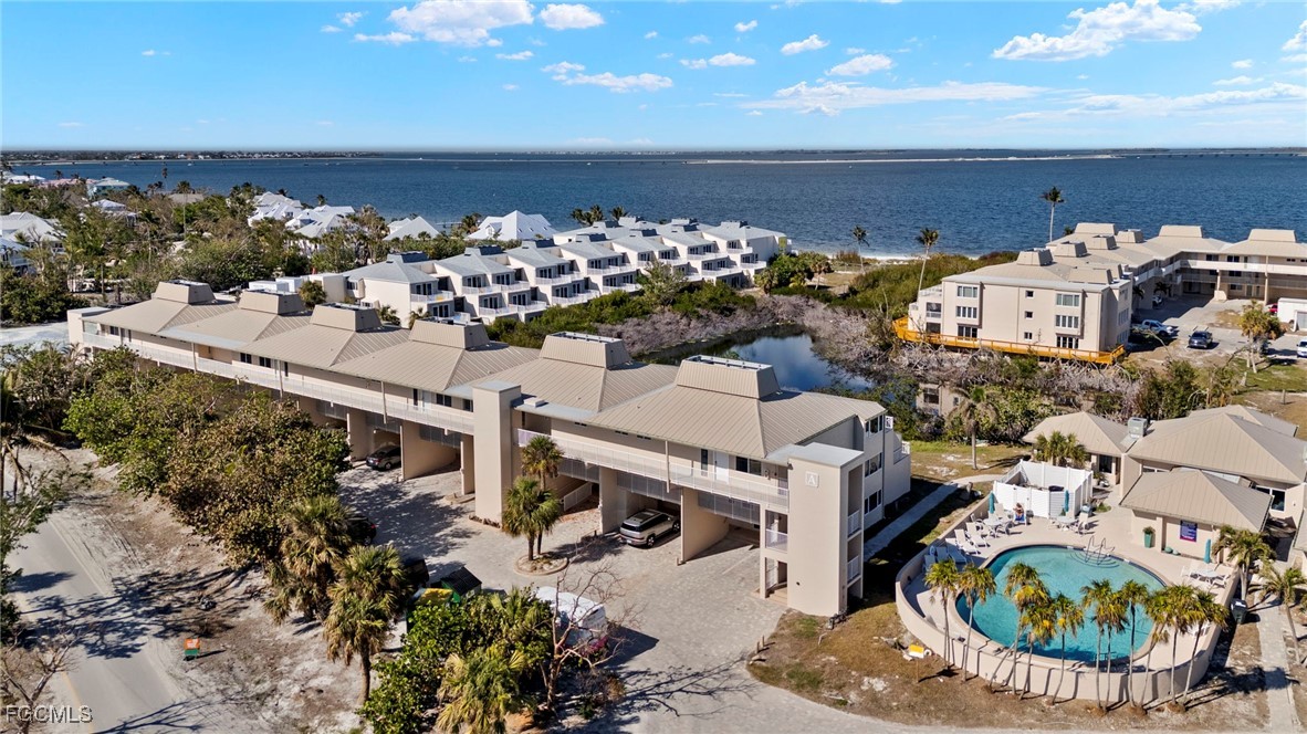 200 Periwinkle Way, Unit 315 Sanibel, FL 33957 - Photo 30 of 33 a view of a chairs and table in a patio