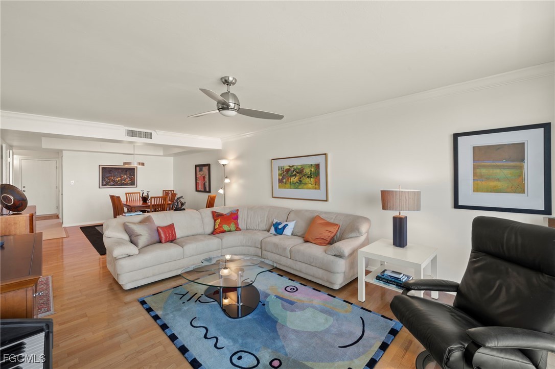 200 Periwinkle Way, Unit 315 Sanibel, FL 33957 - Photo 4 of 33 a living room with furniture kitchen view and a window