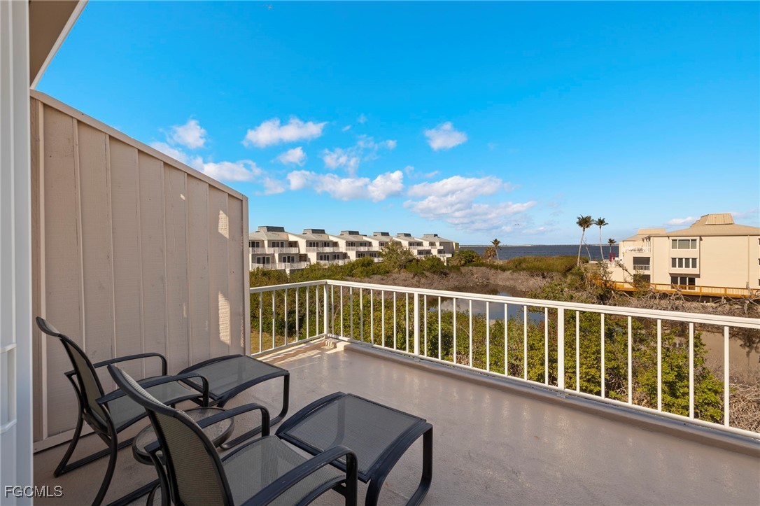 200 Periwinkle Way, Unit 315 Sanibel, FL 33957 - Photo 9 of 33 a view of a balcony with furniture