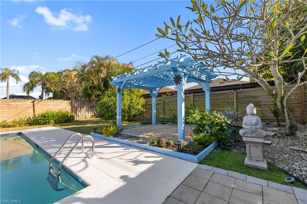 604 110th Avenue North Naples, FL 34108 - Photo 32 of 41 a view of a patio with table and chairs and potted plants