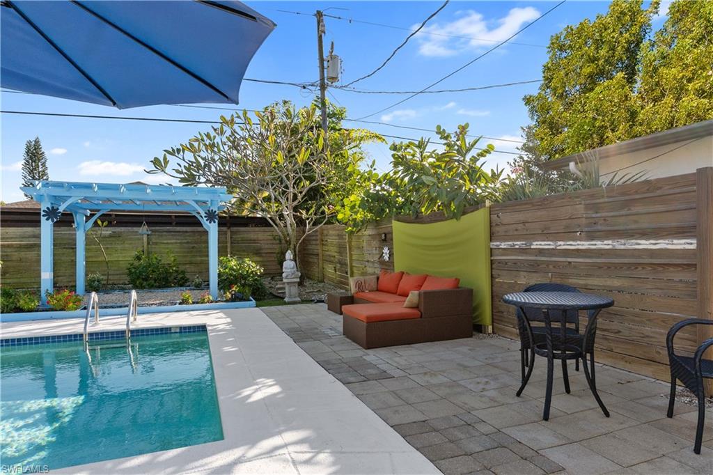 604 110th Avenue North Naples, FL 34108 - Photo 33 of 41 a view of a chairs and table in the patio