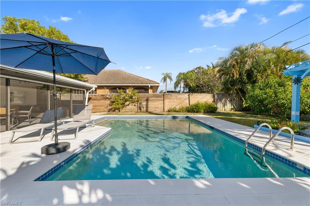 604 110th Avenue North Naples, FL 34108 - Photo 35 of 41 a view of a swimming pool with a patio