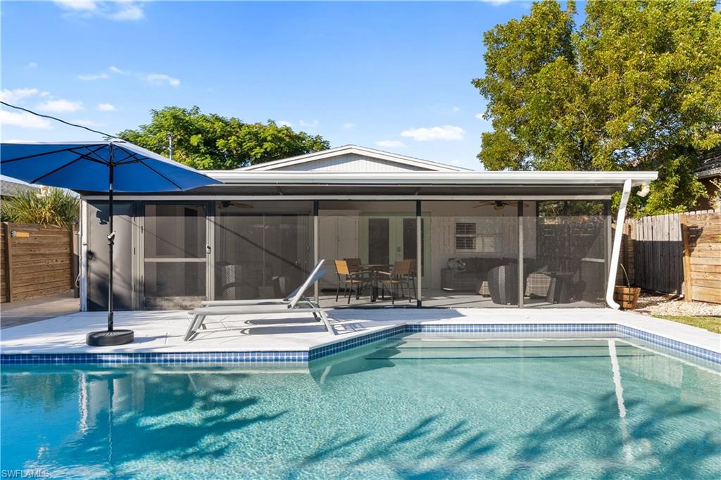 604 110th Avenue North Naples, FL 34108 - Photo 36 of 41 a view of a house with backyard sitting area and swimming pool