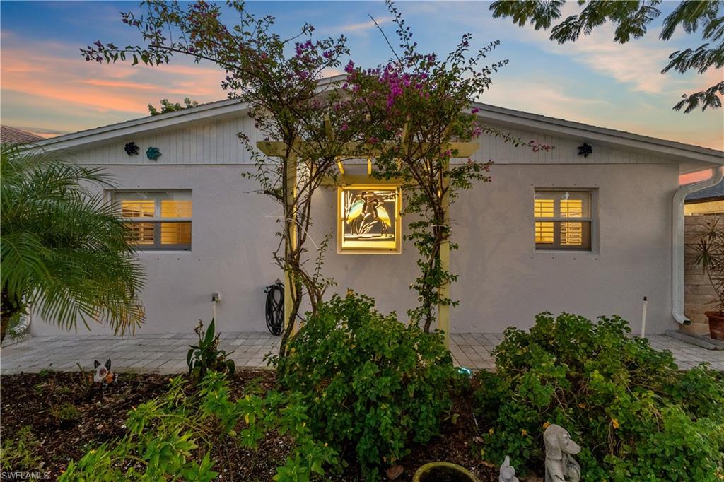 604 110th Avenue North Naples, FL 34108 - Photo 38 of 41 a plant is in front of a house