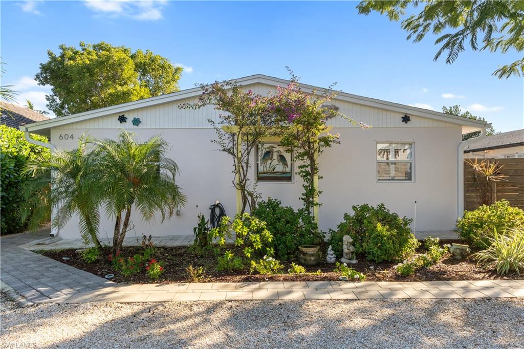 604 110th Avenue North Naples, FL 34108 - Photo 4 of 41 front view of a house with a yard