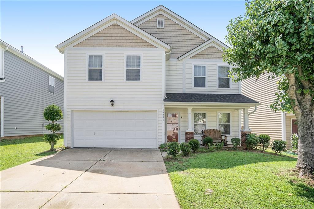 10901 Slalom Hill Road Charlotte, NC 28278 - Photo 1 of 36 a view of a white house next to a yard and a large tree