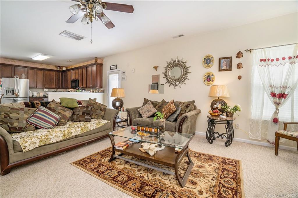 10901 Slalom Hill Road Charlotte, NC 28278 - Photo 12 of 36 a living room with furniture and wooden floor