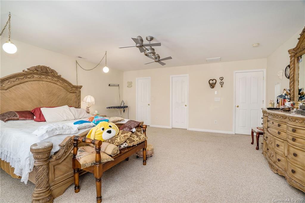 10901 Slalom Hill Road Charlotte, NC 28278 - Photo 23 of 36 a bedroom with a bed and dresser