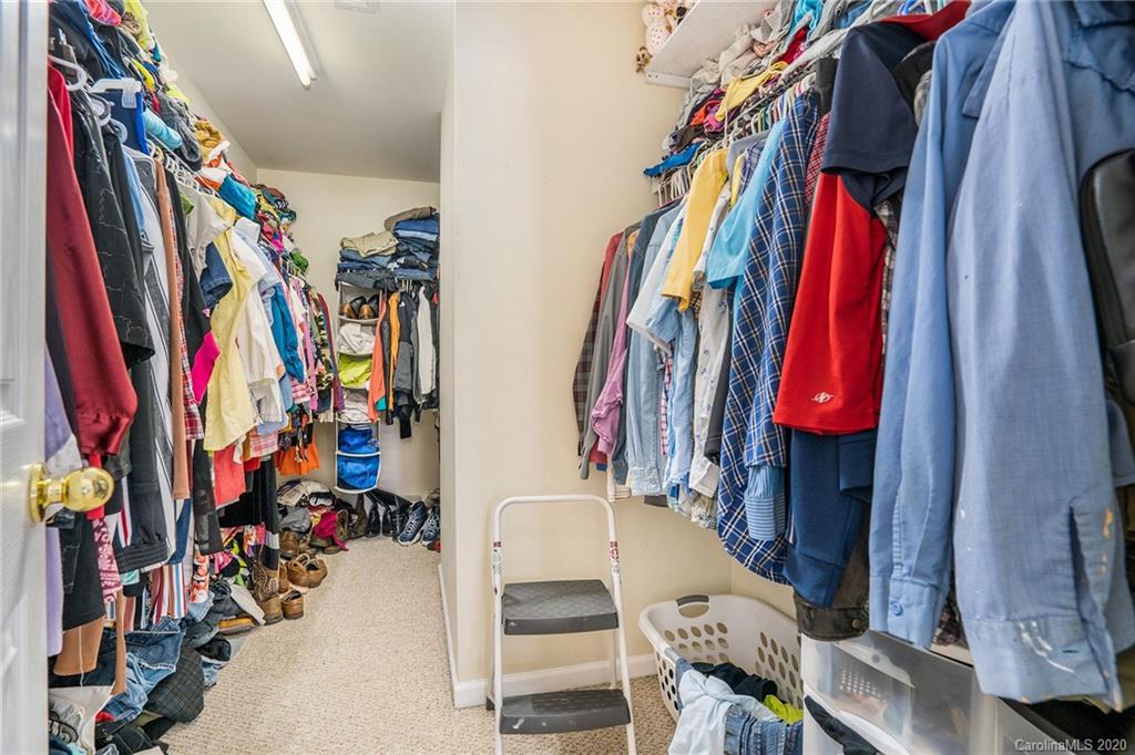 10901 Slalom Hill Road Charlotte, NC 28278 - Photo 24 of 36 a view of walk in closet with clothes