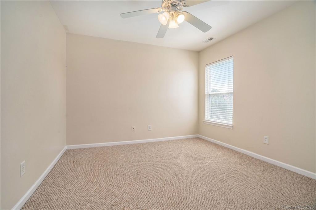 10901 Slalom Hill Road Charlotte, NC 28278 - Photo 31 of 36 an empty room with windows and fan