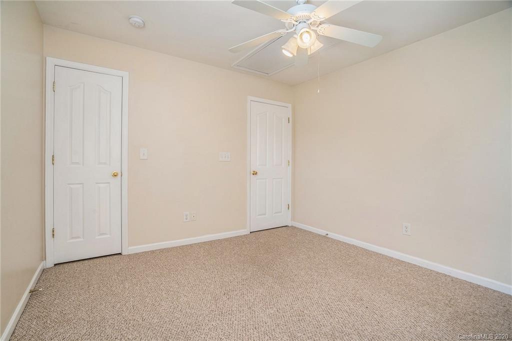 10901 Slalom Hill Road Charlotte, NC 28278 - Photo 32 of 36 an empty room with a fan and a fan