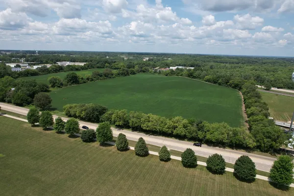 an aerial view of a houses with outdoor space and street view