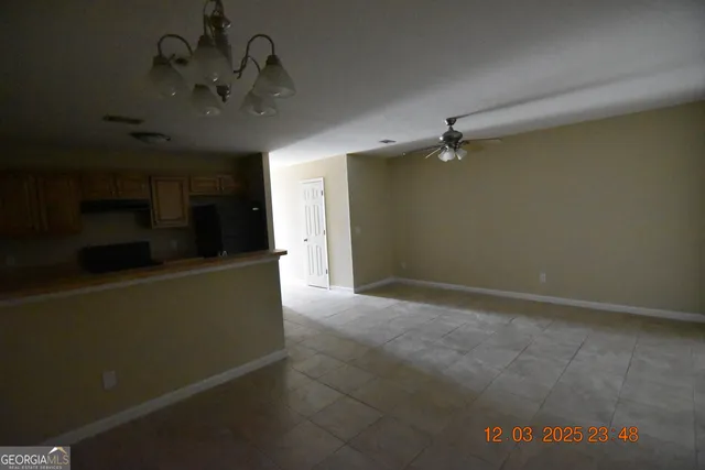 wooden floor in an empty room with a mirror