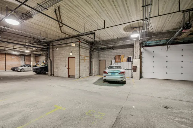 a view of empty room with wooden floor and fireplace