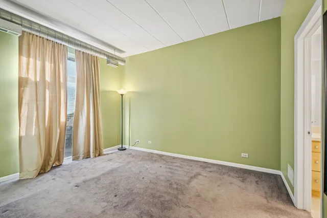 a view of a balcony with chairs