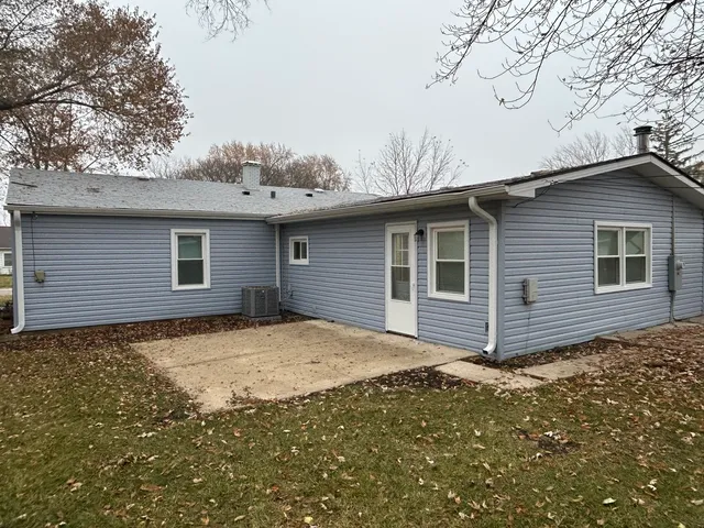 a house with trees in the background