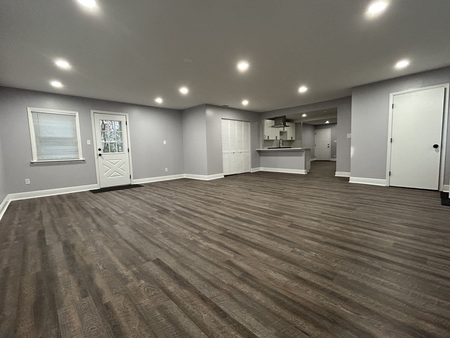 616 Parkside Circle Streamwood, IL 60107 - Photo 8 of 15 an empty room with wooden floor and windows