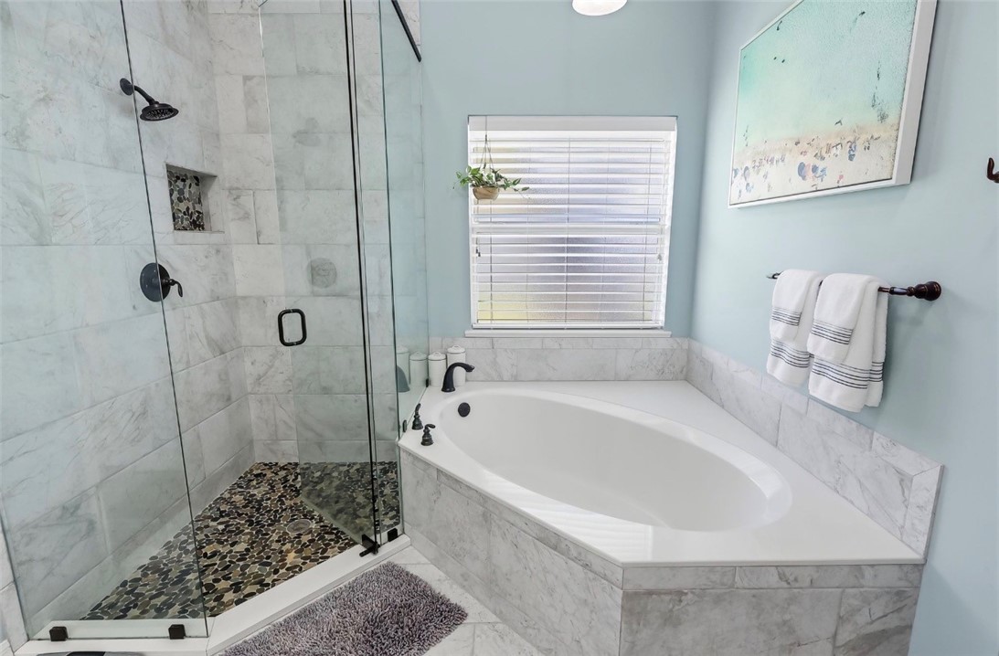 1771 Mistletoe Street Sebastian, FL 32958 - Photo 20 of 36 a bathroom with a bathtub and shower